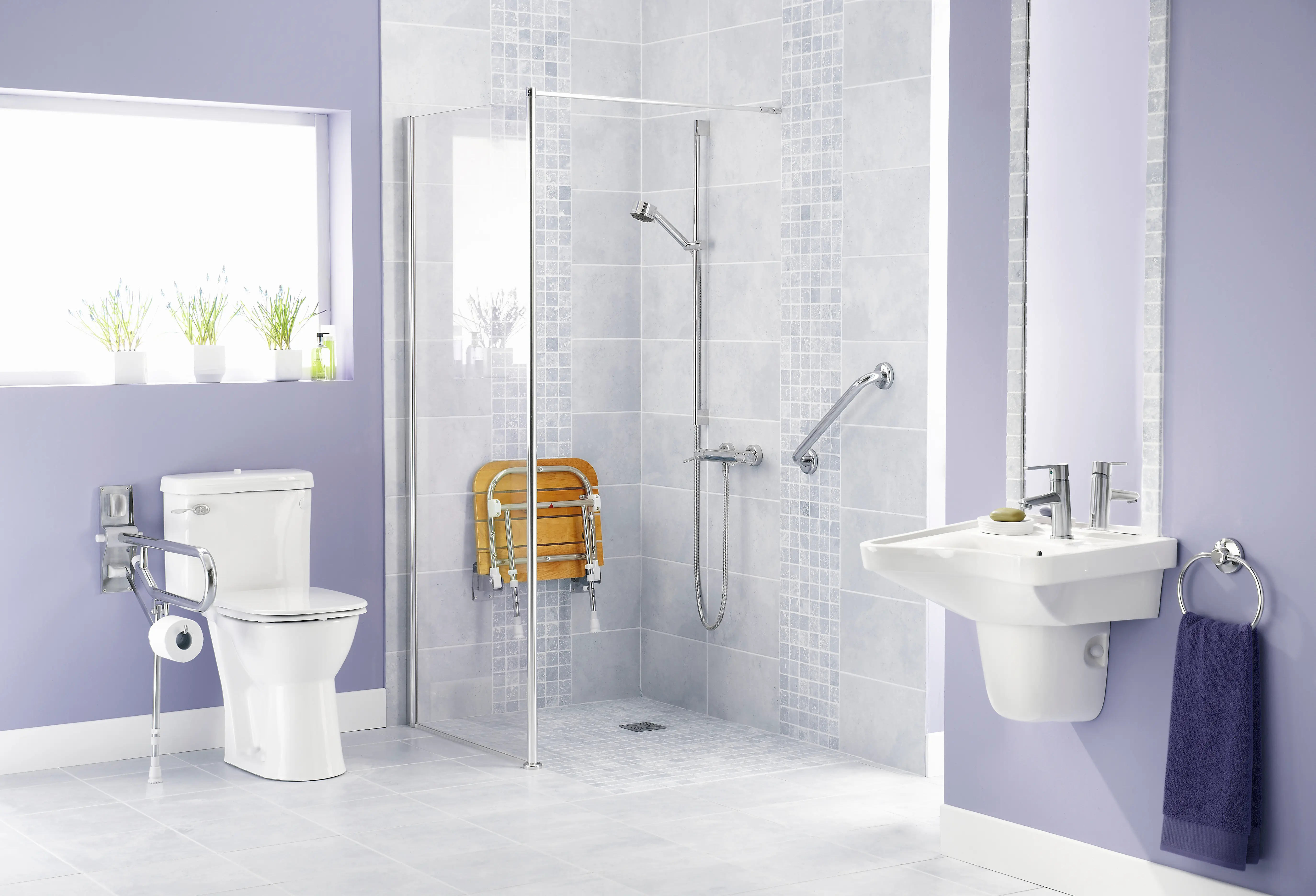 A step-in shower and bathroom equipped with safety and mobility items.
