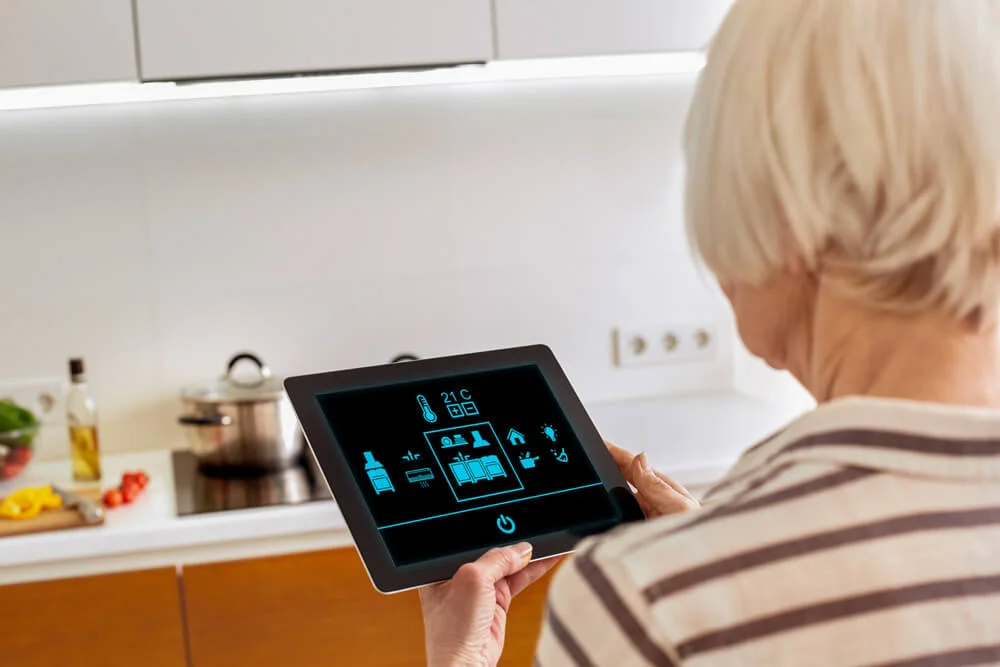Woman looking at smart home settings in iPad.