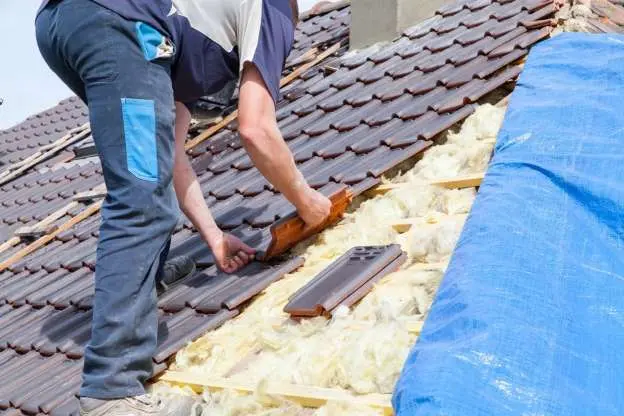A man repairing a roof.