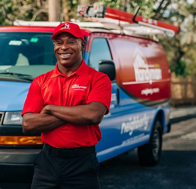 A Mr. Handyman professional standing in front of a van in Louisville, KY.