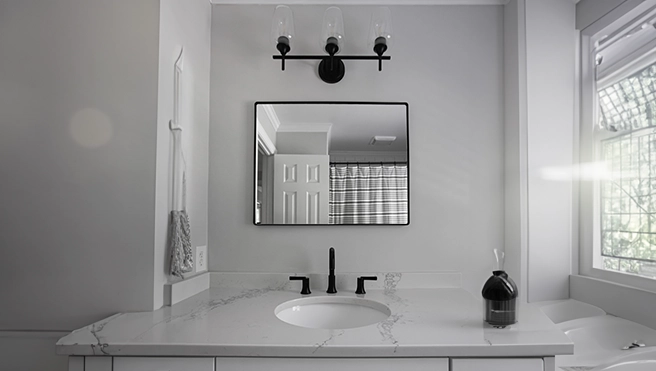 Modern bathroom with a soft natural light filtering through a window.