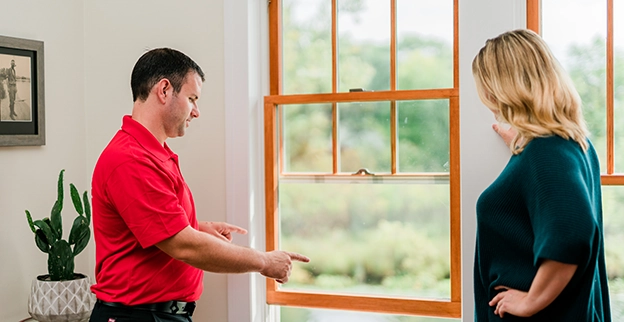 Technician discussing about window repair.