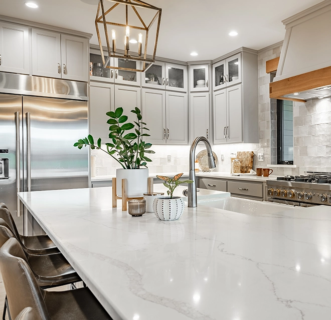 Modern kitchen featuring gray cabinetry.