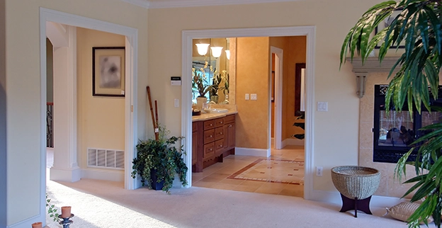 A bright stylish interior showing a hallway painted white.
