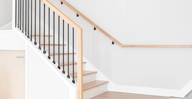 Modern staircase with wooden steps.