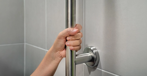 A person holding a steel handle.