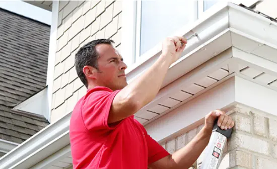 Mr. Handyman technician fixing gutter