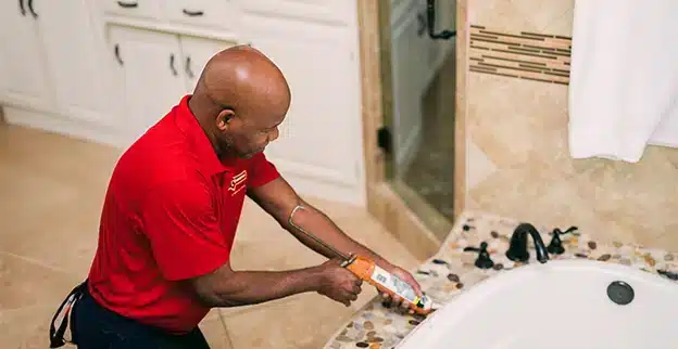 Mr. Handyman professional caulking bathroom sink.