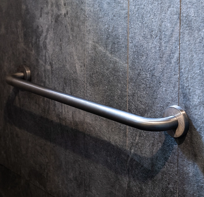 Slate wall with handicap handrail.